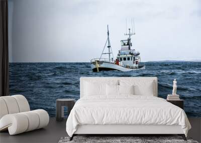 fishing boat in open ocean Wall mural