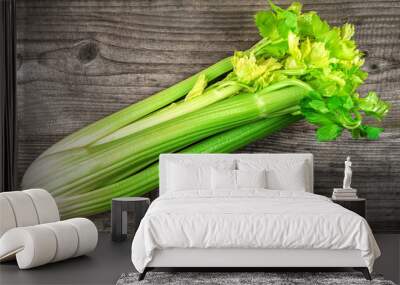 raw celery twig on wooden background Wall mural