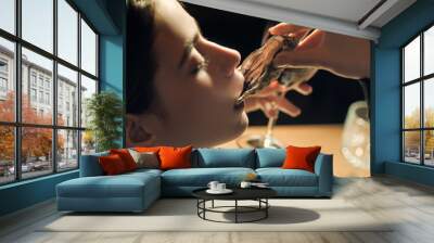 Syster shell in mouth. Beautiful woman in expensive restaurant eat oyster and lick on cafe background. Wall mural