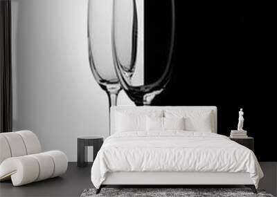 Two empty glasses of champagne with reflection, on a white and black gradient background. Club life concept. Wall mural