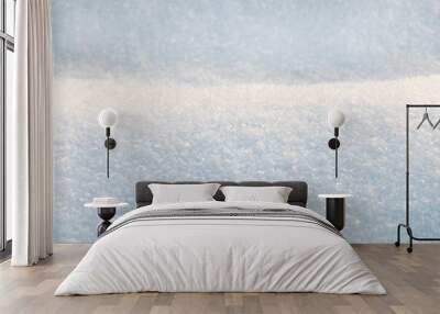 Winter background with snow-covered wavy uneven ground surface, snow texture Wall mural