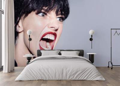 woman shouting and screaming loud with open mouth. human emotions, facial expression concept. shout  Wall mural