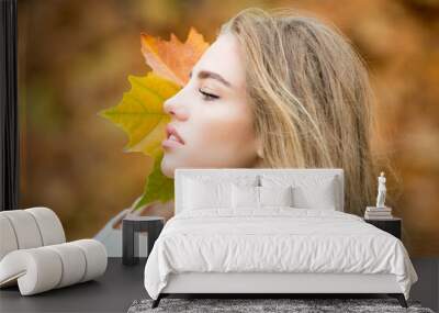 Young woman in a romantic autumn scenery. Wall mural