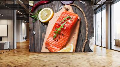 Delicious portion of fresh salmon fillet with aromatic herbs, spices and vegetables - healthy food, diet or cooking concept. Wall mural