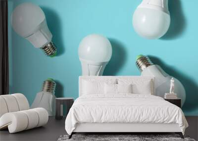 LED light bulbs on blue color background. Flat lay. Pattern. Wall mural