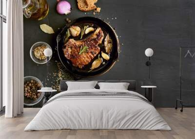 Pork steak in frying pan, top view Wall mural