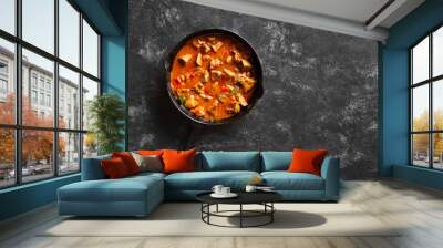 Stewed chicken livers in frying pan Wall mural