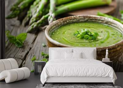 Asparagus soup in wooden bowl on table Wall mural