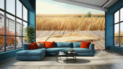 Blank table with tablecloth against blurred wheat field background Shavuot themed design and product display Wall mural