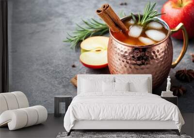 Cocktail with apple cider and cinnamon stick in copper mug on concrete background Wall mural