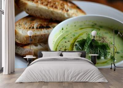 Minted sweet pea soup with cream olive oil drizzle grilled ciabatta Wall mural