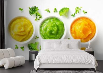 Top view of baby food puree in bowl with green yellow and orange colors isolated on white Wall mural