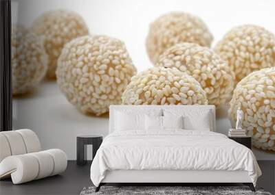 White sesame seed balls with heated jaggery a delicious and nutritious treat against a white backdrop Wall mural