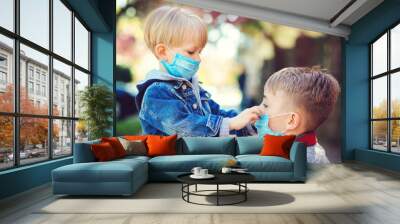 Children wearing face masks outdoors. Prevention coronavirus. Back to school. Coronavirus quarantine. Wall mural