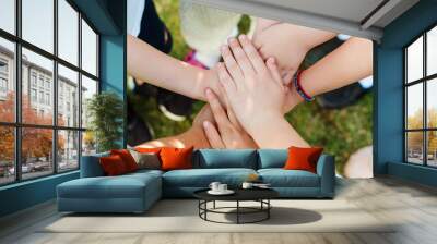 Group of young people's hands. Team, teamwork, unity and friendship concept. Wall mural