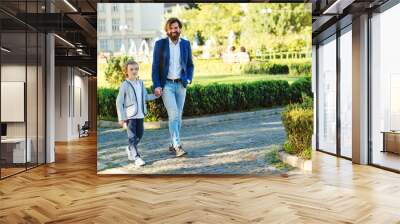 Handsome father and kid wearing stylish suits. Family, fashion and lifestyle. Wall mural