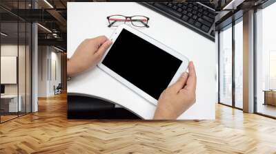 Woman hands holding a white tablet for use Wall mural