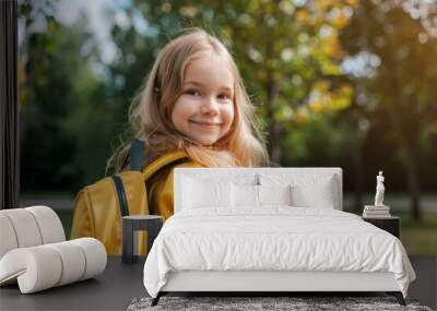 Cheerful young girl ready for first day of school Wall mural