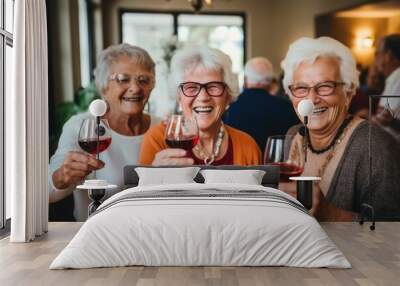 Joyful Senior Friends Toasting with Wine at a Gathering Wall mural