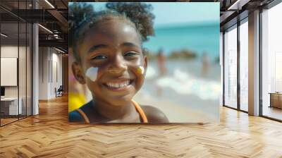 Portrait of a smiling little girl with sunscreen at the beach Wall mural