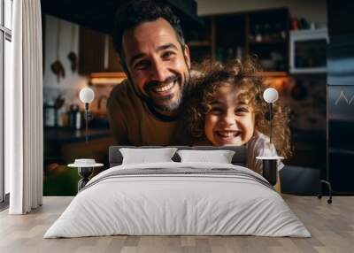 Smiling portrait of a young father and his daughter at home Wall mural