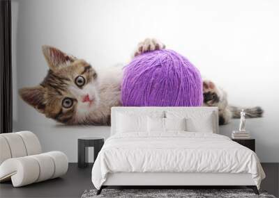 One striped kitten with a ball of yarn. Wall mural