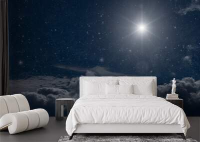 The star shines on the Christmas Eve of Jesus Christ. Wall mural