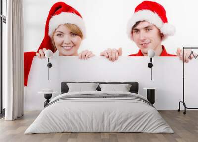 Couple with blank empty banner board. Christmas Wall mural