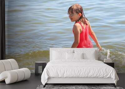 Little girl kid in sea water. Fun Wall mural