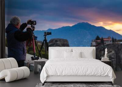 Man take photo from Meteora monastery Wall mural