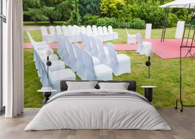 Many wedding chairs with white elegant covers Wall mural