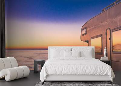 Rv camper camping on sea shore, Spain. Wall mural