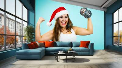 Santa claus woman lifting dumbbells Wall mural