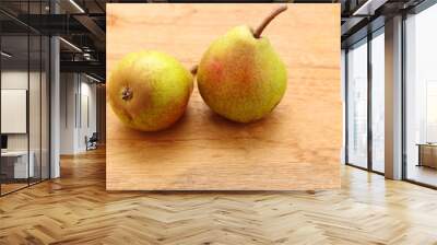 two pears fruits on wooden table background Wall mural