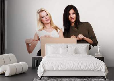 two women with blank board Wall mural