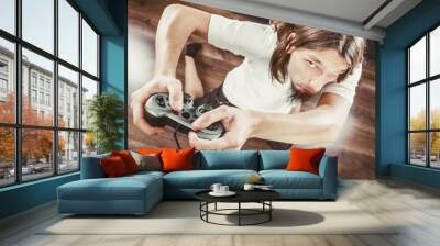 Unhappy male playing games Wall mural