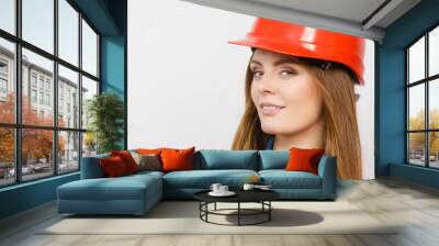 Woman engineer construction builder in helmet. Wall mural