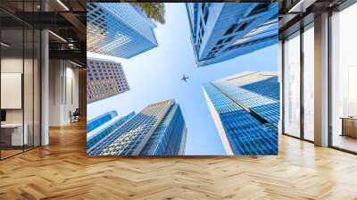 Asia Business concept for real estate and corporate construction - looking up view of panoramic modern city skyline with blue sky in tokyo, japan Wall mural