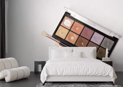 Closeup shot of eyeshadow palette with brushes Wall mural