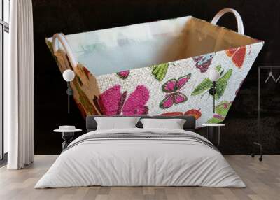 Colorfull textil basket on the dark background Wall mural