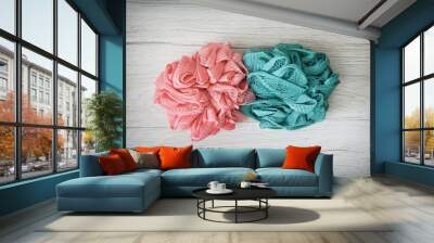 Pink and turquoise washcloths on the wooden background Wall mural