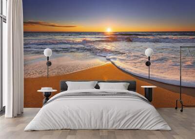 Brilliant ocean beach sunrise. Wall mural