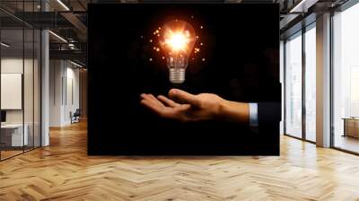 businessman holding a light bulb graphic Digital technology abstract. idea Creative Wall mural