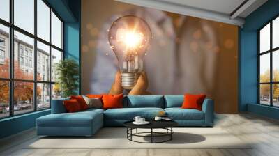 businessman holding a light bulb graphic Digital technology abstract. idea Creative	 Wall mural