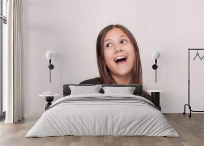 Portrait of young beautiful cute cheerful girl smiling looking at camera over white background. Studio shot of good-looking beautiful woman isolated against blank studio wall. Wall mural