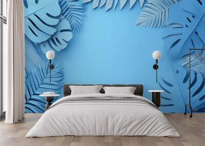 Blue tropical leaves on blue background Wall mural