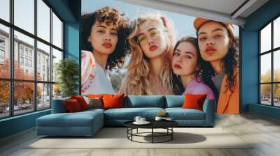 A group of young, fashionable women posing together with a modern style and confident expressions Wall mural