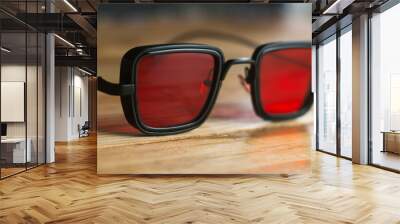 sunglasses with red lenses, creative glasses a Wall mural