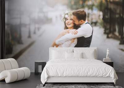 A romantic moment for loving couple, a tender and gently embrace in the street Wall mural