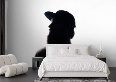 Bearded Man portrait silhouette in backlight. Handsome bearded mna looking away on white background Wall mural